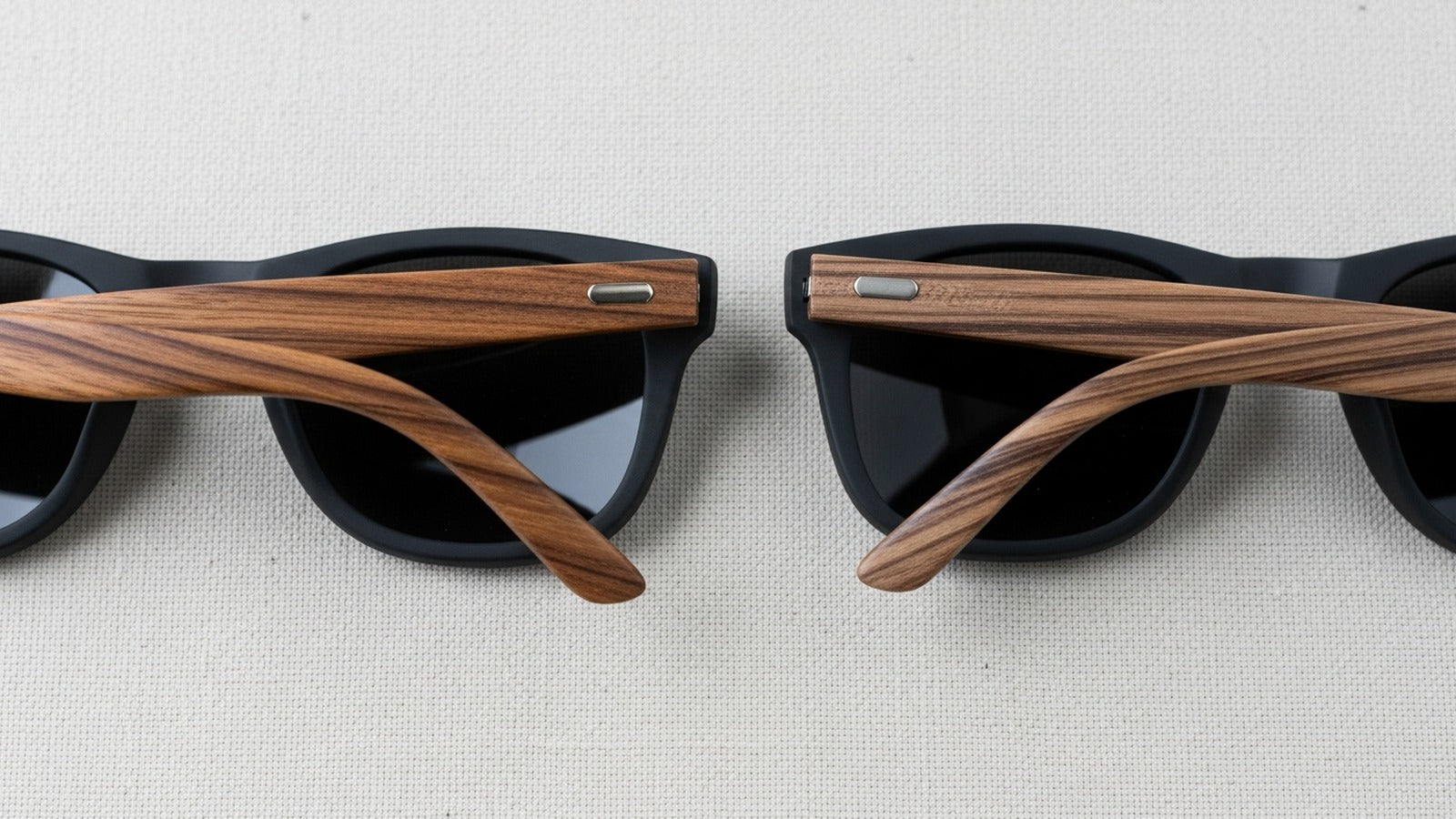 Two Cali Life wood frame sunglasses showing natural grain variation — no two pairs alike