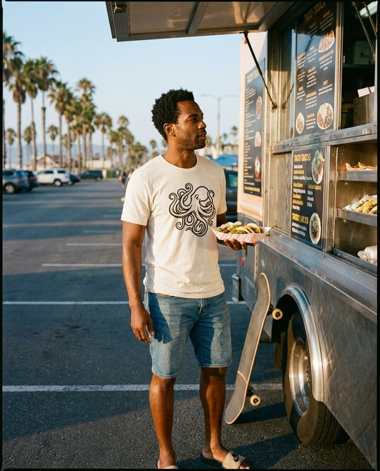 Octopus Art California Tee styled with denim shorts at a Venice Beach taco truck, Bella+Canvas 3001 bone white, Cali Life Co apparel.
