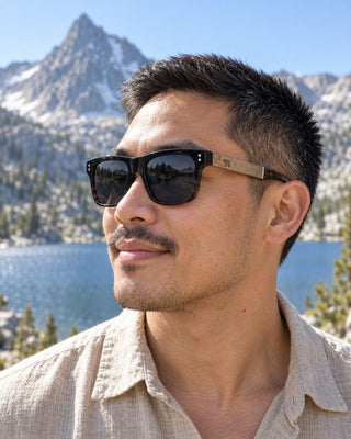 Pyramid Peak polarized sunglasses worn by a man beside an alpine lake in the Sierra Nevada